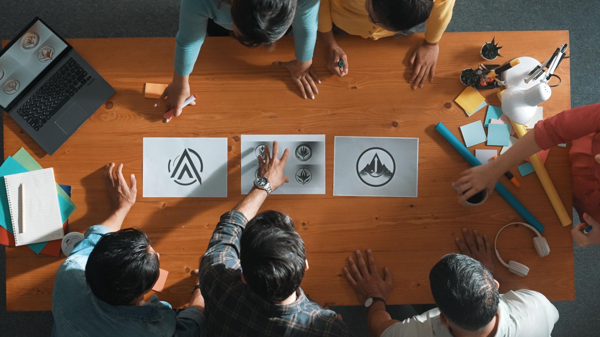 Top view of smart business team put graphic logo on meeting table. Symposium.